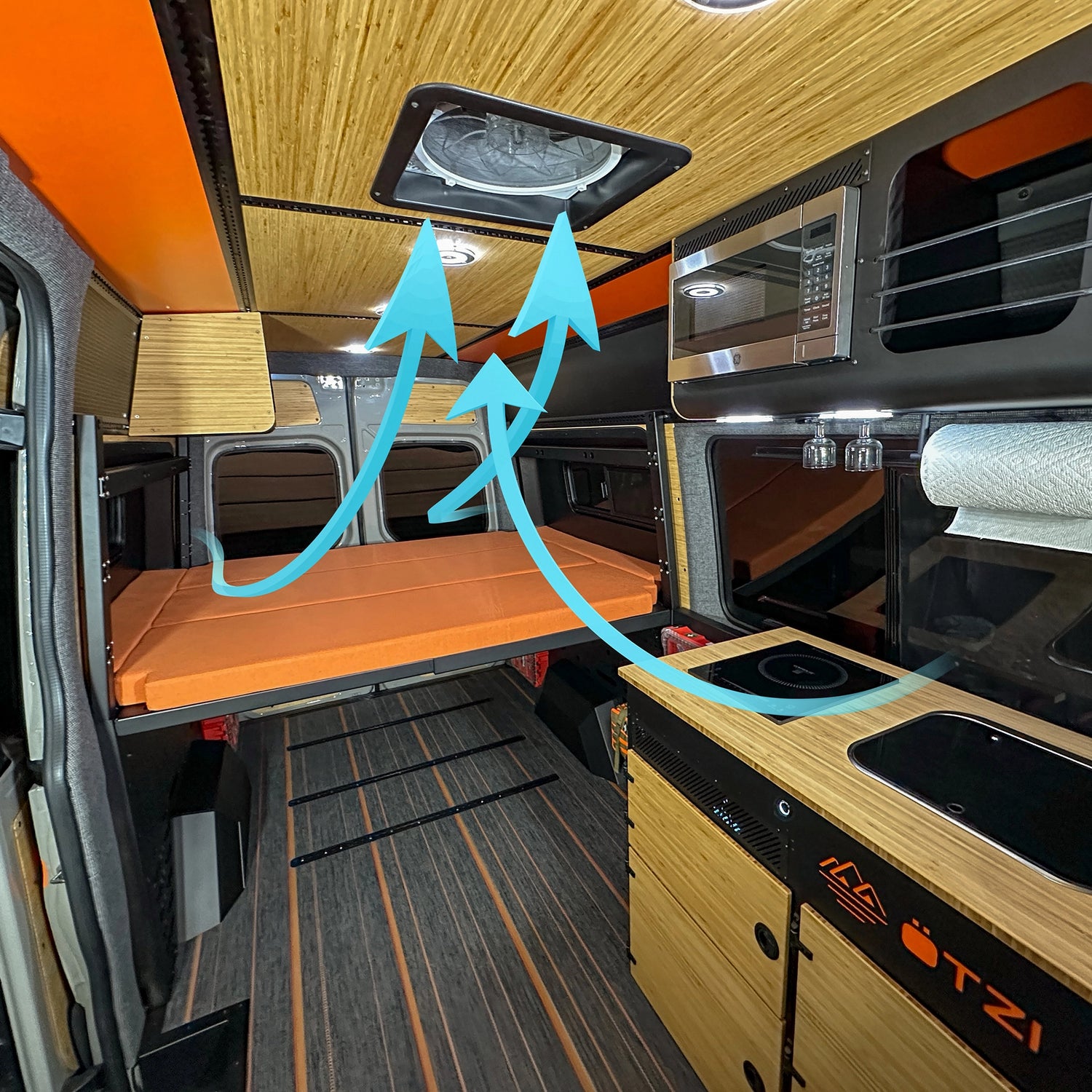 Off‑road camper van layout with swivel seats and workstation, ideal for remote vanlife work