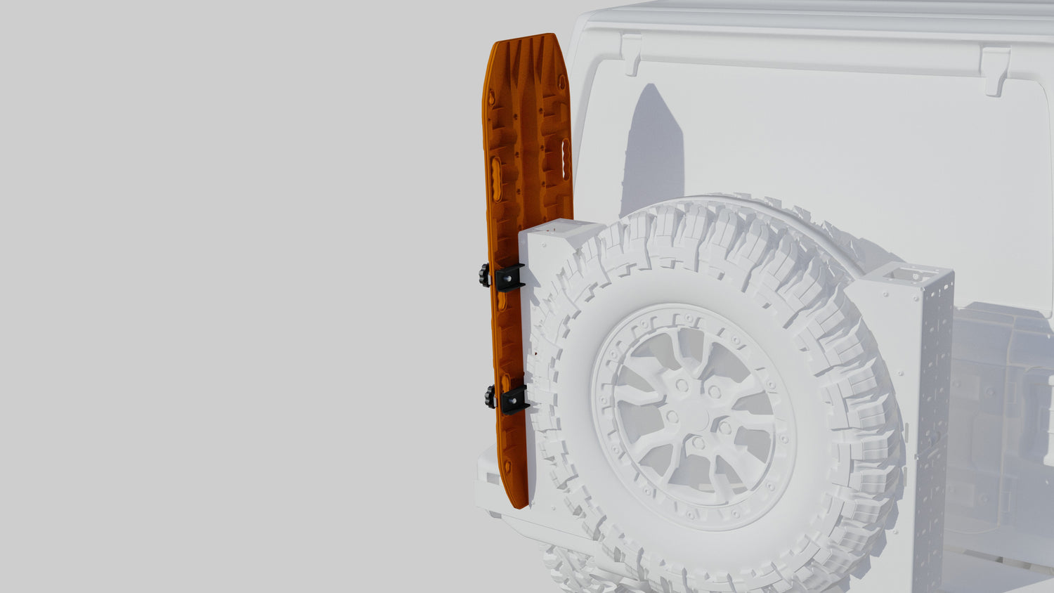 Orange traction board mounted vertically on rear tire carrier of an off-road vehicle