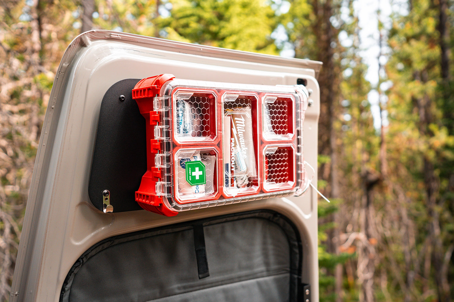 Custom camper van cabinetry with soft‑close drawers, overhead storage, and integrated LED lighting