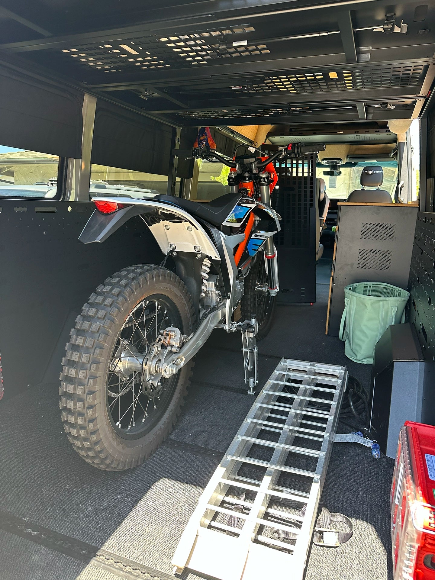 Off‑road adventure van interior with built‑in shower and toilet for self‑contained vanlife camping