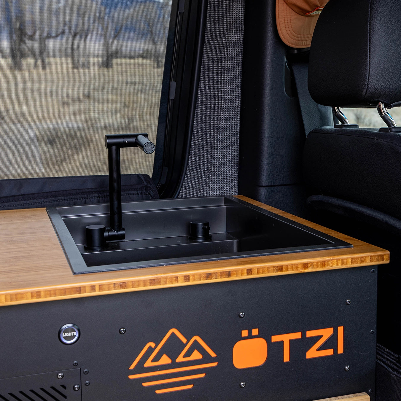 Adventure van interior with compact kitchen and solar power, optimized for off‑grid camping