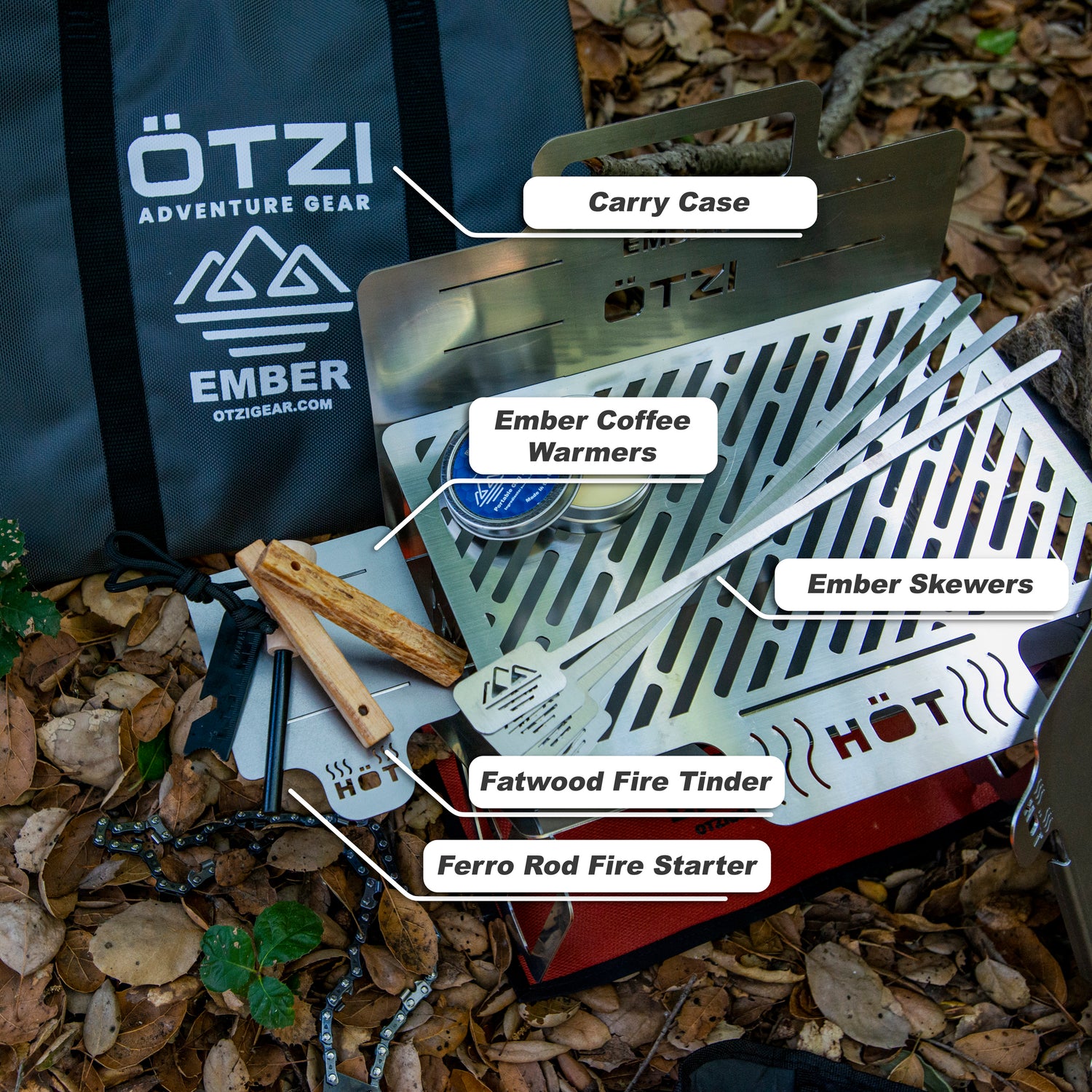 Outdoor cooking set including grill, skewers, coffee warmers, fire starter, and carry case on forest floor.