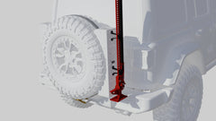 Red high-lift jack mounted on the rear tire carrier of an off-road vehicle