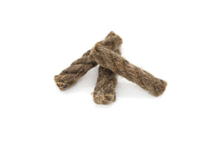 Three twisted natural fiber dog chews on a white background