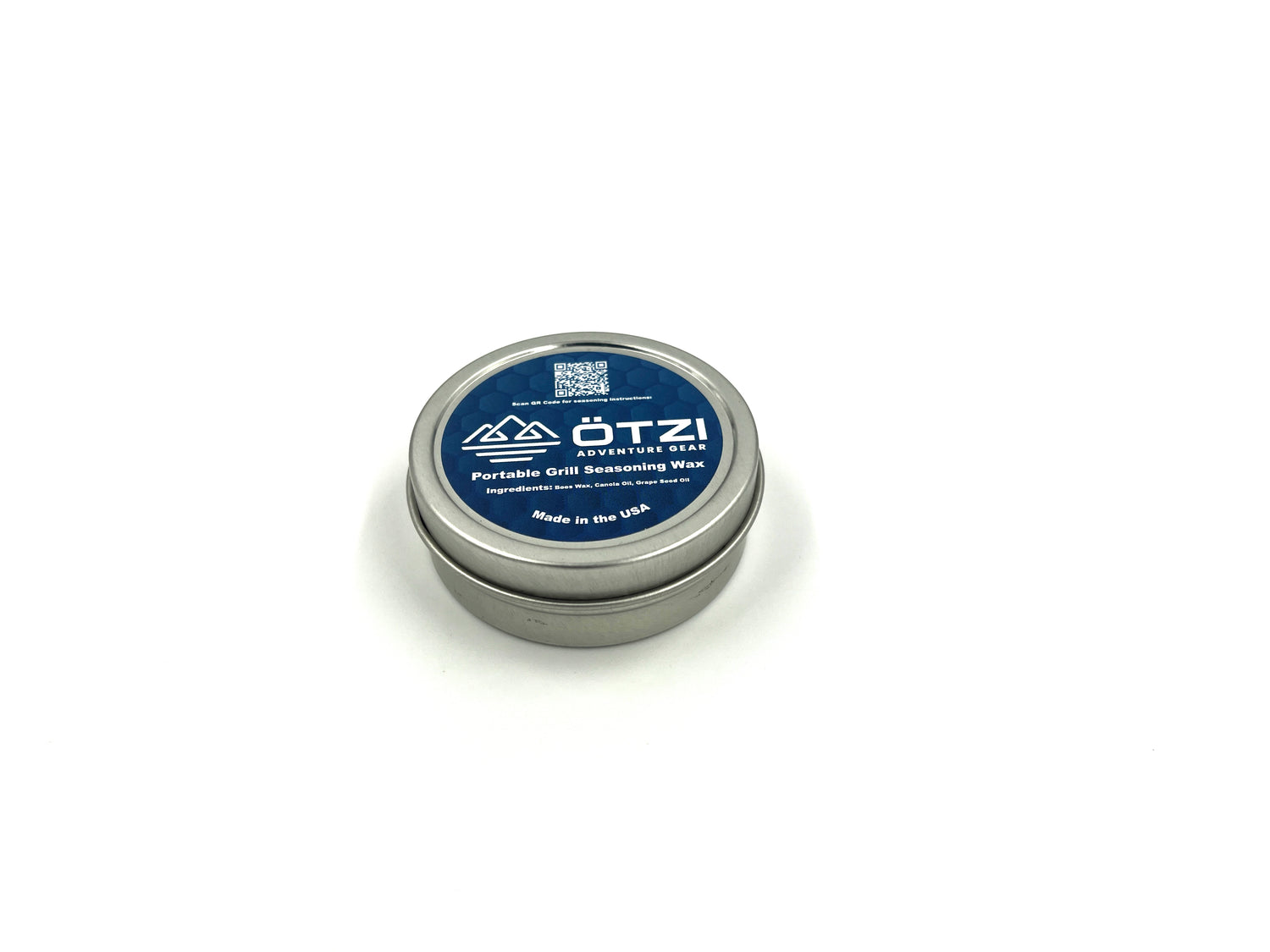 Small metal tin of ÖTZI Adventure Wax with blue label on white background.