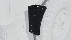 Black metal mount bracket attached to the rear tire area of an off-road vehicle