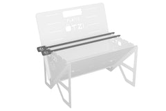 Black metal skewers resting on a white portable grill frame