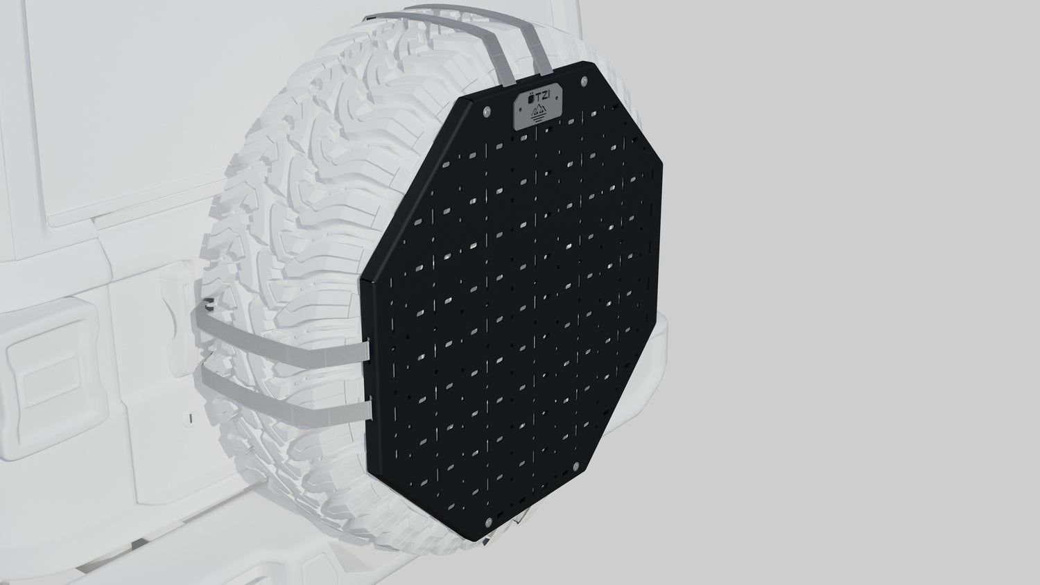 Black octagonal spare tire cover with mounting panel attached to a white off-road vehicle.